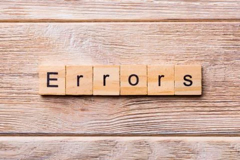 Errors word written on wood block. Errors text on wooden table for your desin Stock Photos