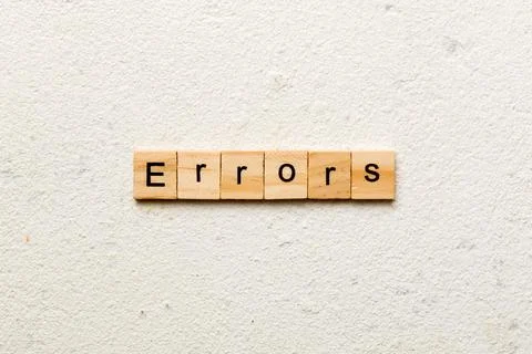 Errors word written on wood block. Errors text on cement table for your desin 스톡 사진