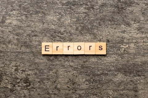 Errors word written on wood block. Errors text on cement table for your desin Stock Photos