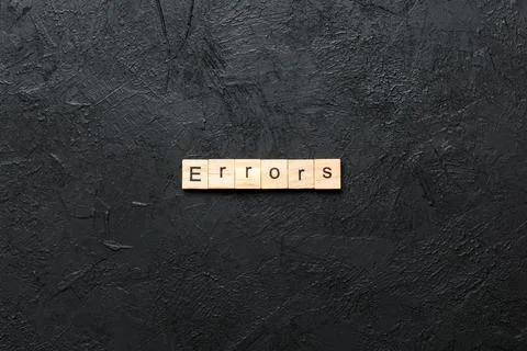 Errors word written on wood block. Errors text on cement table for your desin Stockfoto's