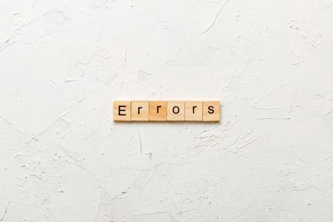 Errors word written on wood block. Errors text on cement table for your des.. 스톡 사진