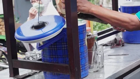 Es Kelapa Muda or young coconut ice, a popular Indonesian drink. Stock Footage 210373530