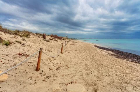 Es Trenc beach under dramatic gloomy sky. Mallorca island Stock Photos