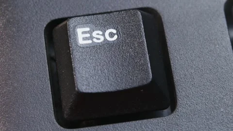 Esc or Escape Key on Desktop Keyboard Pressed by Finger Hand Multiple Times Stock Footage 290470806