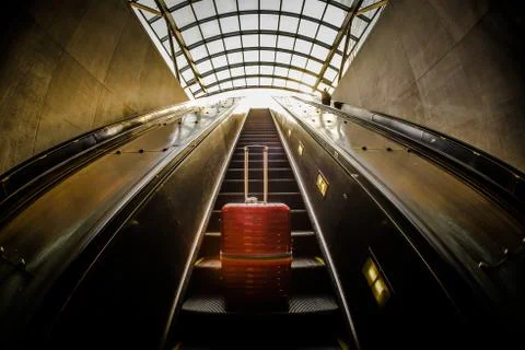 Escalator and suitcase Stock Photos