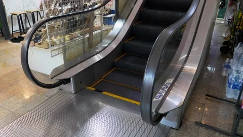 An Escalator With A Black Railing Moves Up Stock Footage 262981800