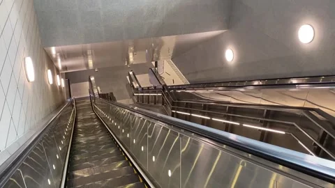 Escalator into the concourse of Marina Bay MRT station, Thomson-east Coast Line Stock Footage 291533855