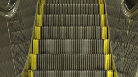 Escalator Descending - frontal with reflections.m2t Stock Footage 8571219