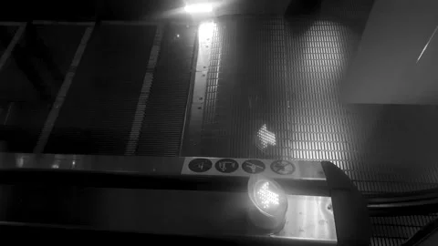 Escalator,an electric elevator in a shopping mall with a lighted arrow sign. Stock Footage 311979767