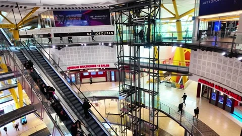 Escalator, elevator, cinema and shops in big Mall in Barcelona, Spain, 4K Stock Footage 273171770