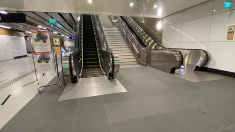 Up the escalator to the exit of Marina Bay MRT Station, Thomson-east Coast Line Stock Footage 291141381