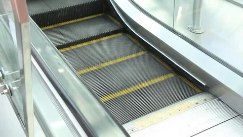 Escalator going UP watch your step Stock Footage 6731797