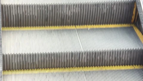 Escalator going UP watch your step closeup Stock Footage 6731839