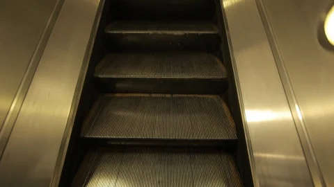 Escalator up into Jubilee Line Underground station Stock Footage 100590960