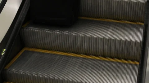 Escalator medium shot of feet 스톡 동영상 33544542