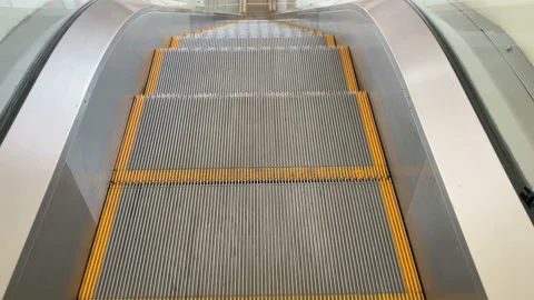 Escalator metallic stairs on way down Stock Footage 140568355