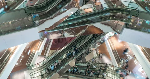 Escalator in modern multi level shopping mall crowd of people. Rush hour. Very Stock Footage 138344525
