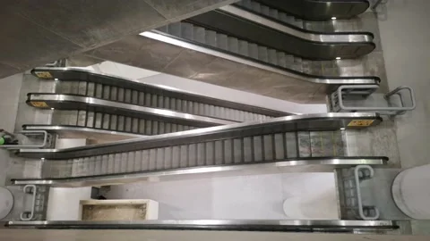 The escalator moves down the building Stock Footage 130297312