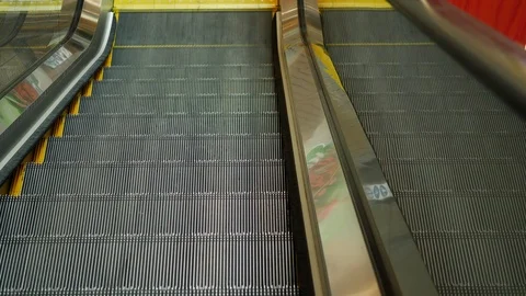 Escalator moving down transport on floor of modern building Stock Footage 89788903