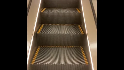The escalator is moving up to the upper floor in a shopping mall. Stock Footage 320009277