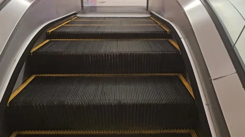 Escalator Moving Upward in Slow Motion with Industrial Metal Steps Stock Footage 328068372