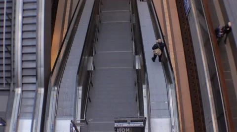 Escalator one man going down 動画素材 46040031