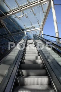 Escalator rolling stairs Stock Photos