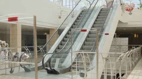 Escalator Running Down. General Plan. Steady Cam Stock Footage 98146122