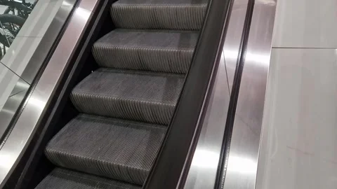 Escalator, side view. Riding an escalator in a public place Stock Footage 262358164