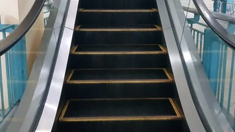 Escalator steps descending in a mall. Closeup Stock Footage 272840672