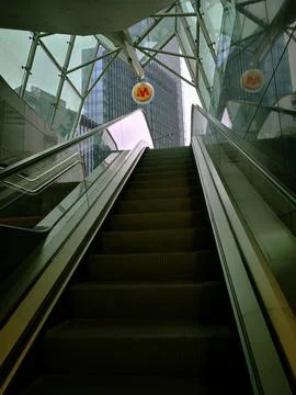 Escalator steps, moving staircase, empty metro elevator, electric stairway, m Stock Photos