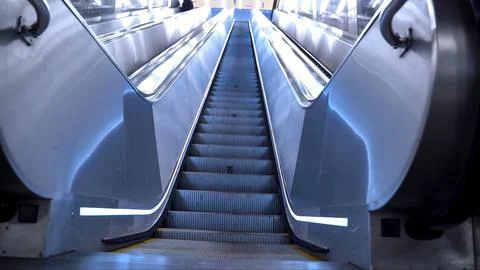 Escalator steps in subway. View from below up Foto stock