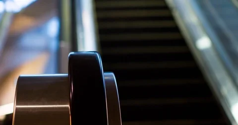 Escalator system focused on rail going up 4k Stock Footage