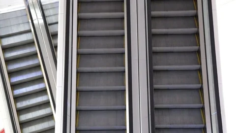 The escalator in two directions up and down constantly moves in public places. Stock Footage 121107932
