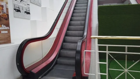 An escalator is a type of vertical transportation Stock Footage 105313452