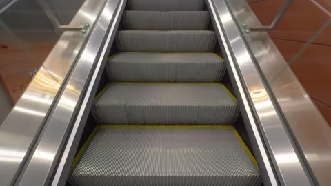 Escalator view in modern indoor space showcasing sleek design and functionality. Stock Footage 311430293
