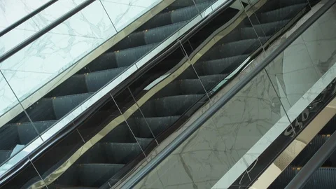 Escalator in the white marble interior room Stockbeeldmateriaal 86274419