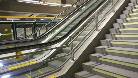Escalator working on empty metro station pandemic 20220114 Stock Footage 168501137