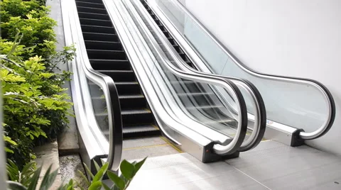 Escalators are shown that constantly run, which moves to basement floor Stock Footage 41871585