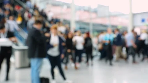 Escalators in a conference hall used by blurred crowd of people Stock Footage 122204158