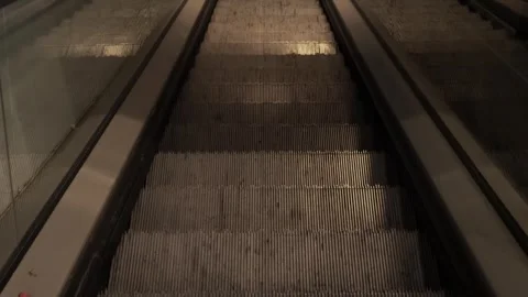 Escalators descend into the metro station Stock Footage 320258133