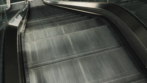 Escalators help transport goods and people inside the building. Stock Footage 112979188