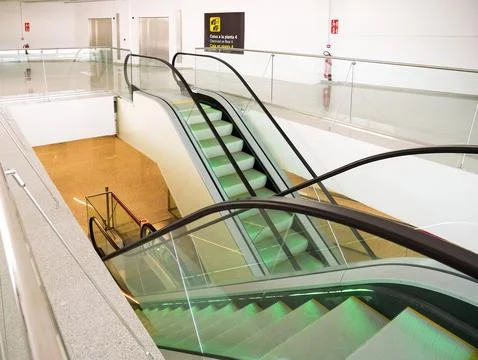 Escalators inside terminal Stock Photos