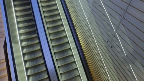 Escalators with lights and crowd of busy people in a subway station Stock Footage 135915531