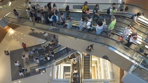 Escalators in modern shopping mall crowd of people. Stock Footage