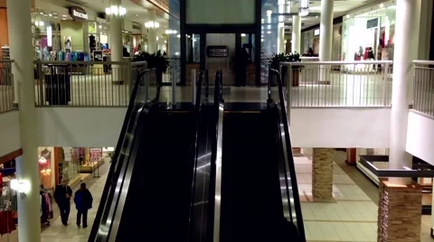 Escalators with shopper coming to lougheed mall shopping center Stock Footage 54222520