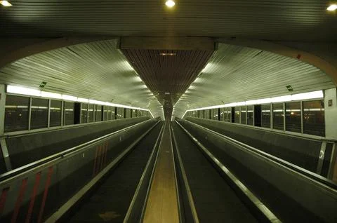 Escalators of the train station that go to the platform Stock Photos
