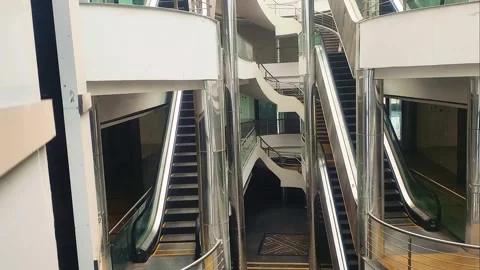 Escalators View From Elevator Moving Down Inside Shopping Mall Jan-30-2026 Stock Footage 327870324