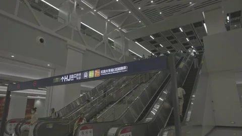 Escalators at Wuhan Metro Line 12 Station With Passengers Stock-Footage 342969500