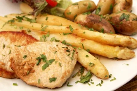 Escalope with asparagus Stock Photos